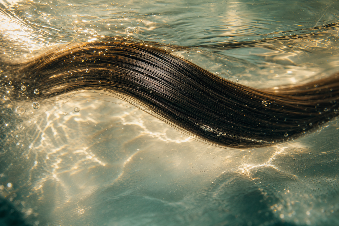 Glossy smooth hair beside a professional protein hair treatment product